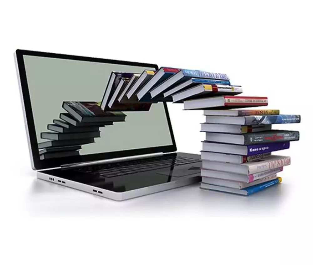 Laptops stacked with books forming a bridge from the screen, symbolizing eBook ghostwriting services.